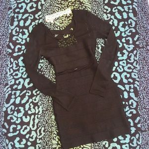 Black shimmering bandage dress.